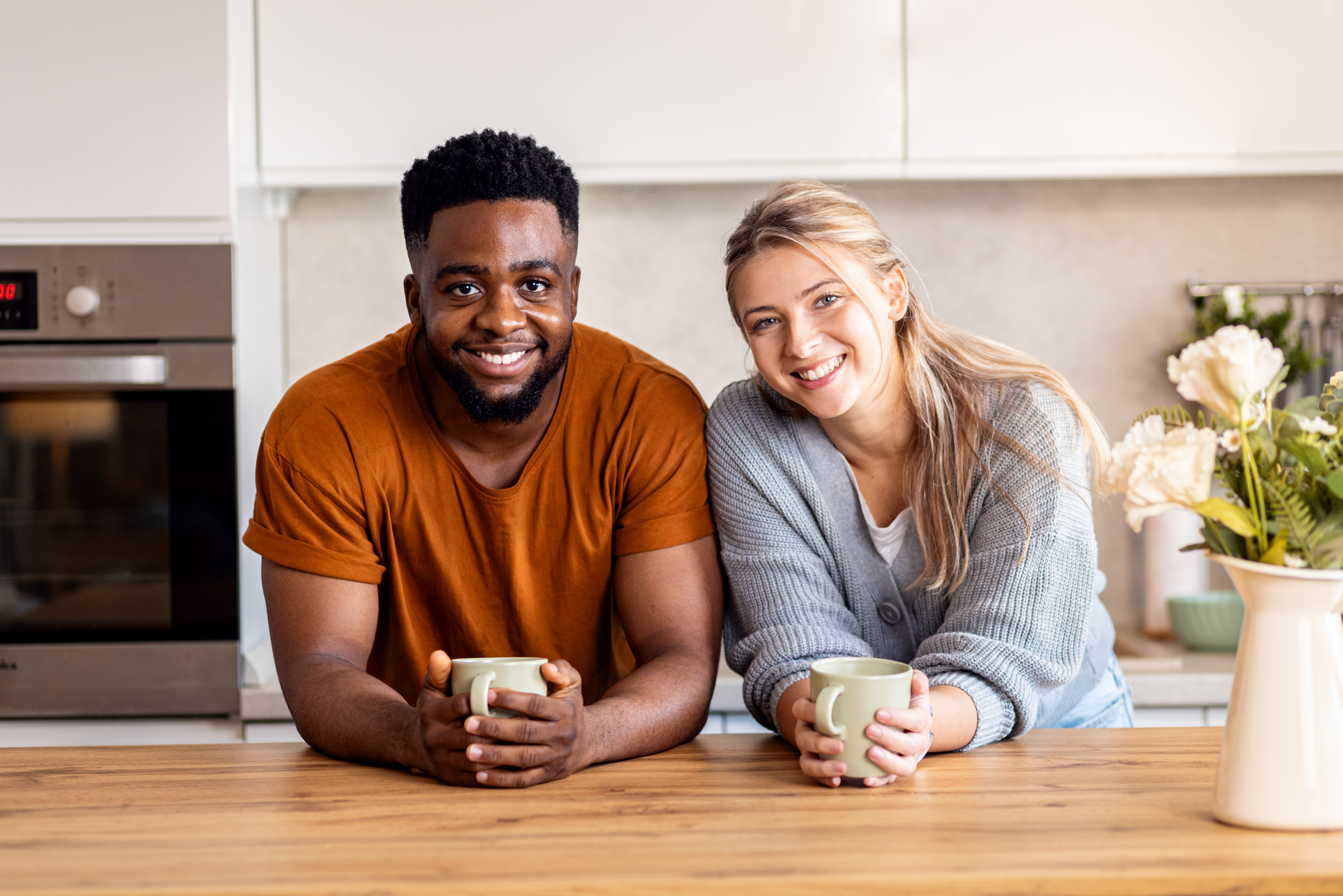 Happy couple in modern kitchen